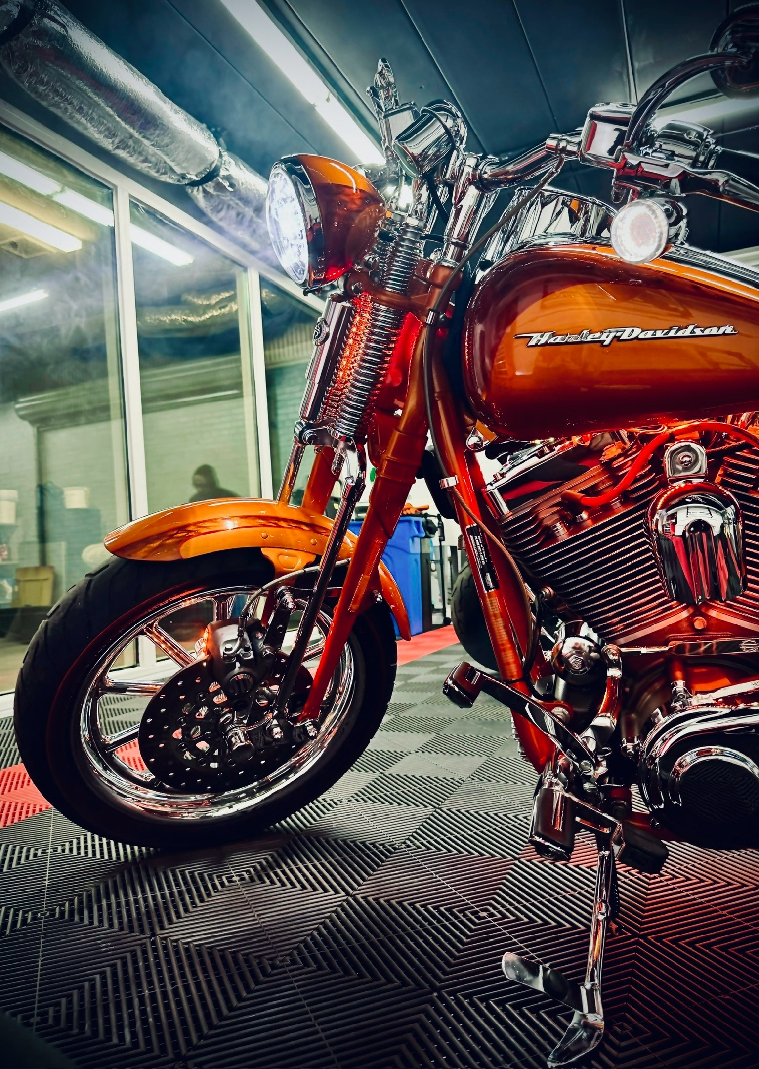 Orange Harley-Davidson on the shop floor