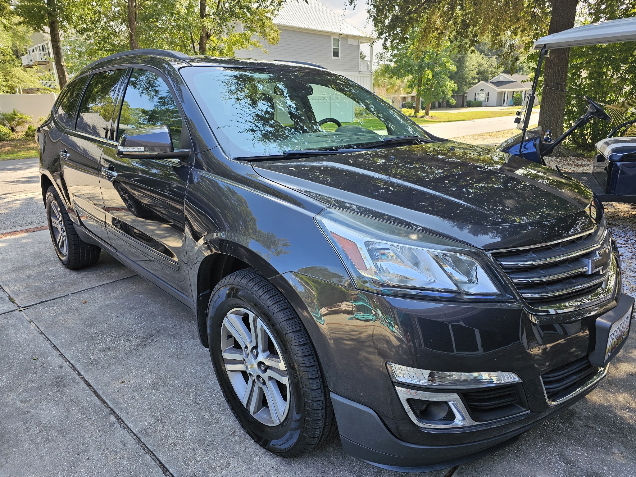 Dark Chevrolet SUV with a deep gloss finish